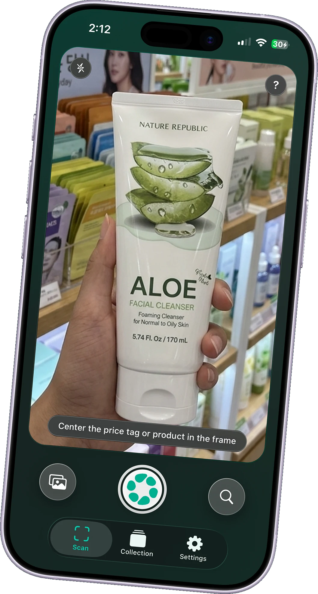 OLMA’s camera scanning an aloe facial cleanser in a shop, with photo, shutter, and search controls.